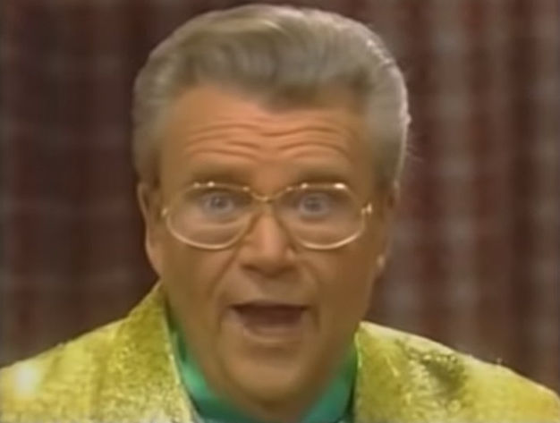Rod is wearing a yellow sequined jacket & green collarless silk shirt