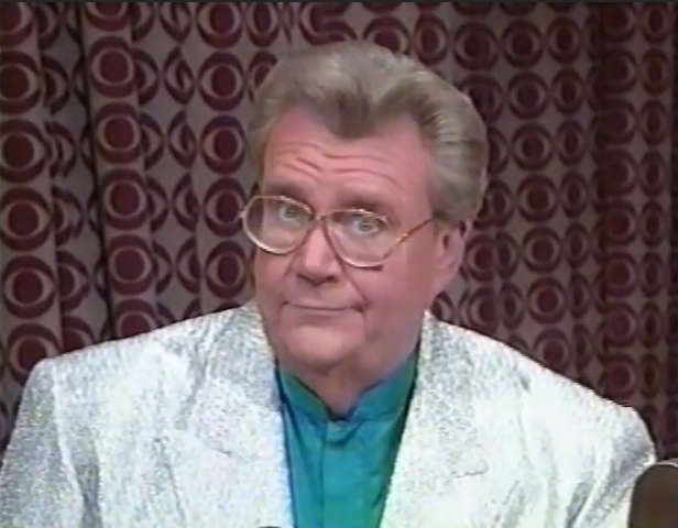 Rod is wearing a silver sequined jacket & seafoam-green collarless silk shirt