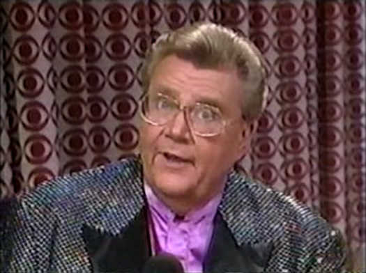 Rod is wearing a black sequined jacket with black lapels & pink silk collarless shirt