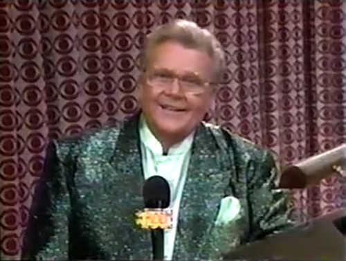 Rod is wearing a dark-green sequined jacket & powder-blue collarless silk shirt with matching pocket square