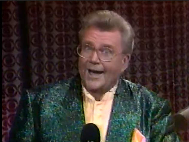 Rod is wearing a dark-green sequined jacket & light-yellow collarless silk shirt
with matching pocket square