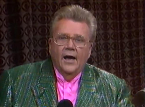 Rod is wearing a dark-green/dark-blue striped sequined jacket & pink collarless silk shirt