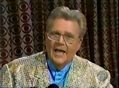 Rod is wearing a gold sequined jacket & sky-blue collarless silk shirt