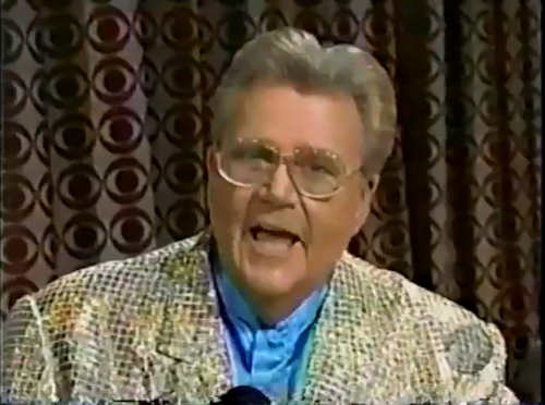 Rod is wearing a gold sequined jacket & sky-blue collarless silk shirt