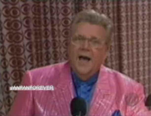 Rod is wearing a shiny pink/pink-striped jacket, blue pocket square & blue silk collarless shirt