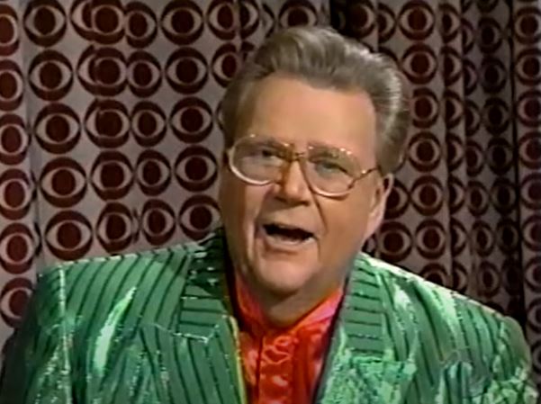 Rod is festive in a shiny green pinstripe jacket & red silk collarless shirt