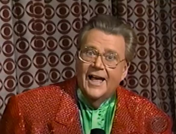 Rod is wearing a red sequin jacket & green collarless silk shirt