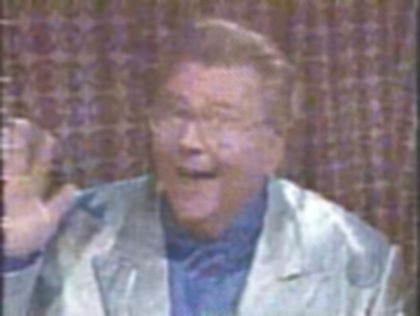 Rod is wearing a silver jacket & blue silk shirt