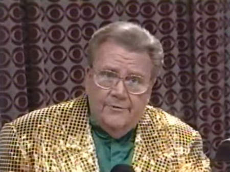 Rod is wearing a gold sequined jacket & dark-green collarless silk shirt