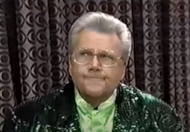 Rod is wearing a dark-green sequin jacket & lime-green collarless silk shirt