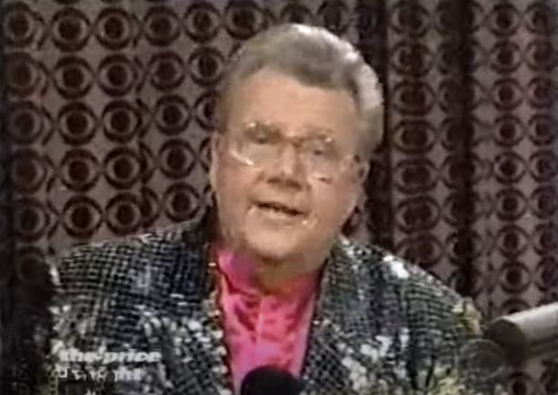 Rod is wearing a silver sequined jacket & pink collarless silk shirt