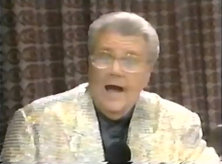 Rod is wearing a gold sequined jacket & black collarless silk shirt