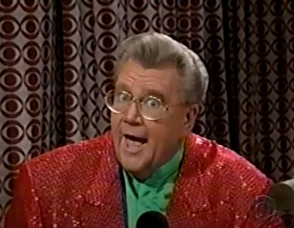 Rod is wearing a red sequined jacket & green silk collarless shirt