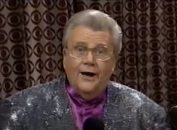 Rod is wearing a silver sequined jacket & purple collarless silk shirt