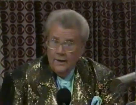 Rod is wearing a gold sequined jacket & mint-green collarless silk shirt with matching pocket square