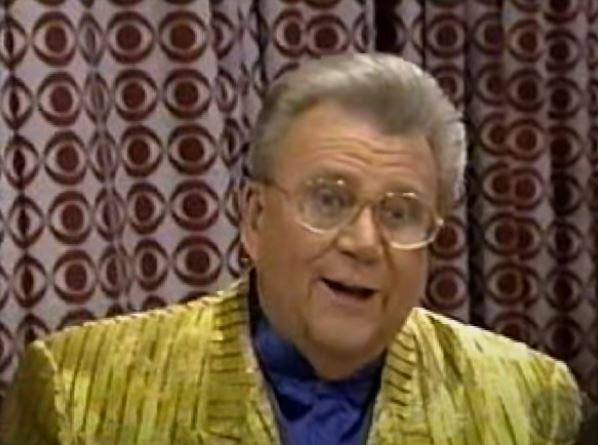 Rod is wearing a shimmery yellow/yellow striped jacket & dark-blue silk collarless shirt