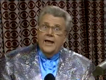 Rod is wearing a silver sequined jacket & light-blue collarless silk shirt