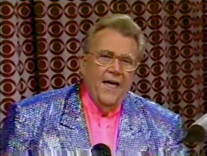 Rod is wearing a preiwinkle sequined jacket & pink collarless silk shirt