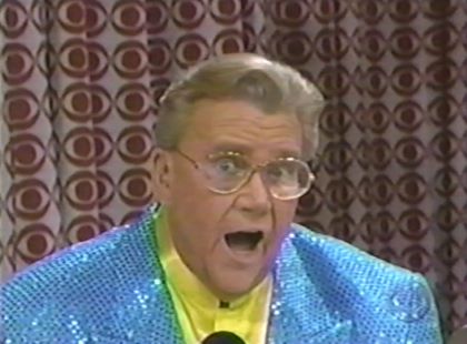 Rod is wearing a blue-sequined jacket & yellow collarless silk shirt
