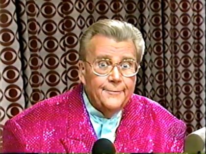 Rod is wearing a pink sequined jacket & pastel-blue collarless silk shirt