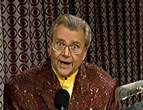 Rod is wearing a brown sequined jacket & yellow collarless silk shirt