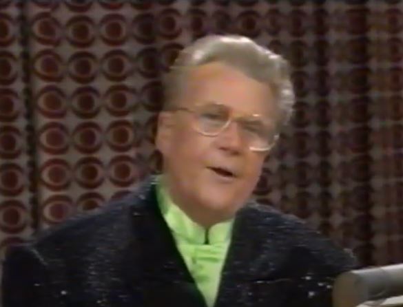 Rod is wearing a black sequined jacket & lime-green collarless silk shirt