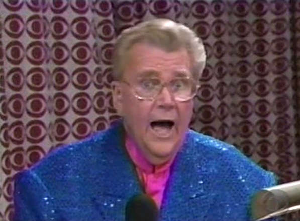 Rod is wearing a blue sequined jacket & fuchsia collarless silk shirt