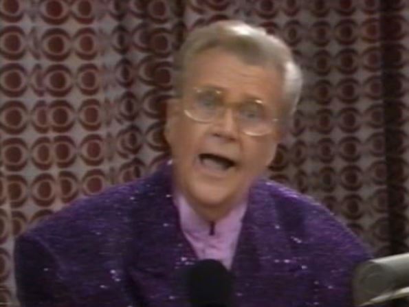 Rod is wearing a purple sequined jacket & lilac silk collarless shirt