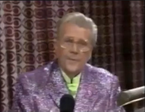 Rod is wearing a lilac sequined jacket & lime-green collarless silk shirt