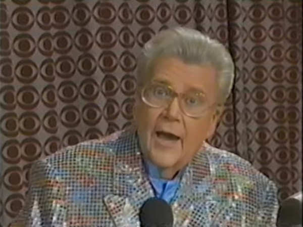 Rod is wearing a silver sequined jacket & powder blue collarless silk shirt