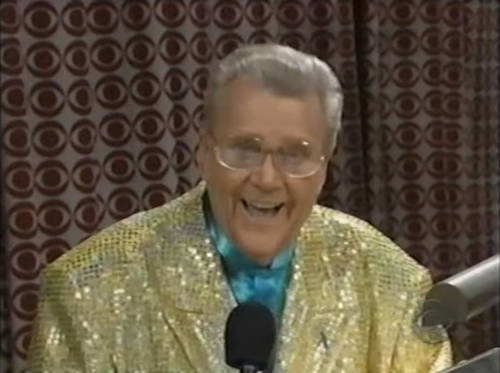Rod is wearing a gold sequined jacket & seafoam-green collarless silk shirt