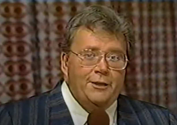 Rod is wearing a Gray/Dark Blue striped suit & white shirt