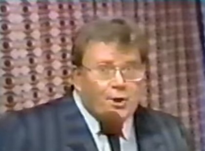Rod is wearing a grey/blue striped jacket, matching necktie & white shirt