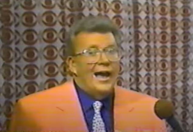 Rod is wearing a Peach-colored jacket, dark blue shirt & polka-doted tie