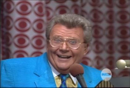 Rod is wearing a blue jacket, dark-blue necktie & yellow shirt with white pin-stripes and white collar