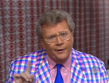 Rod is wearing a blue/violet gingham jacket, blue silk necktie & a violet silk shirt