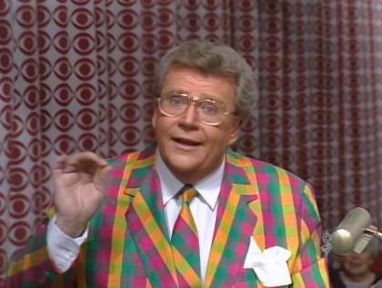 Rod is wearing a green/pink/yellow gingham jacket with matching neck tie, white shirt & matching pocket square