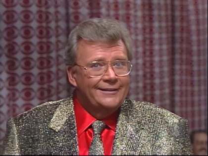 Rod is wearing a sparkly gold jacket matching necktie & red shirt with matching pocket square