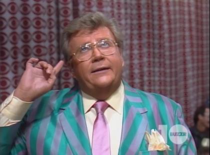 Rod is wearing a green/puce striped jacket, puce necktie, cantaloupe shirt & matching pocket square
