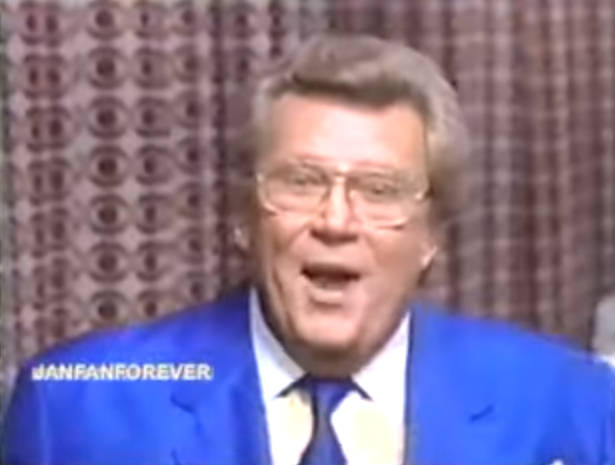 Rod is wearing a blue jacket & tie with a white shirt