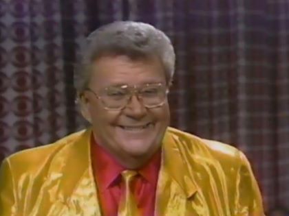 Rod is wearing a shiny yellow jacket with matching necktie & red silk shirt with matching pocketsquare