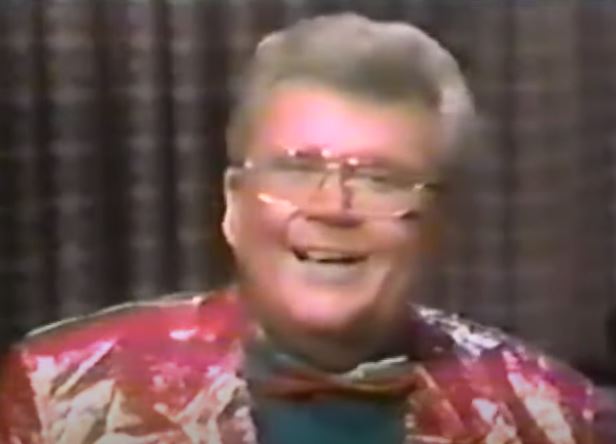 Rod is wearing a shiny pink/gold jacket with matching bow tie & green shirt