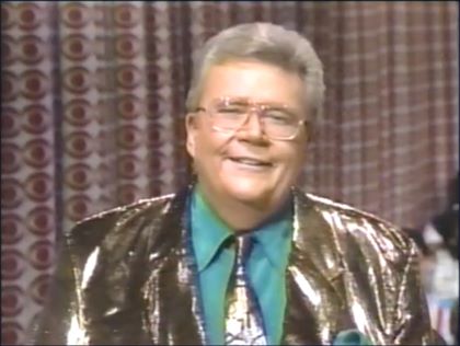 Rod is wearing a shiny bronze jacket, matching necktie & green shirt with matching pocket square