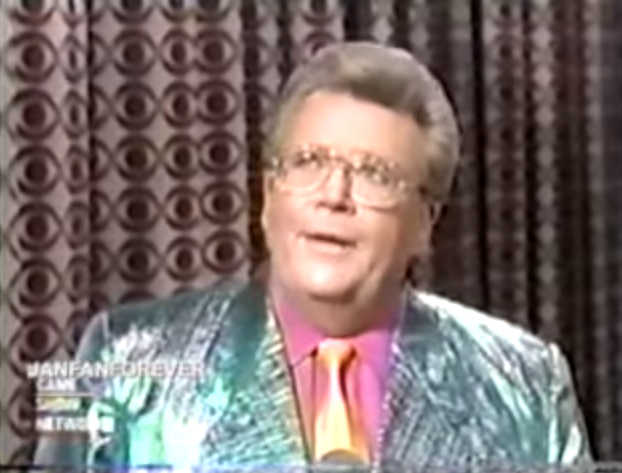 Rod's jacket is iridescent green with a salmon shirt & gold silk tie