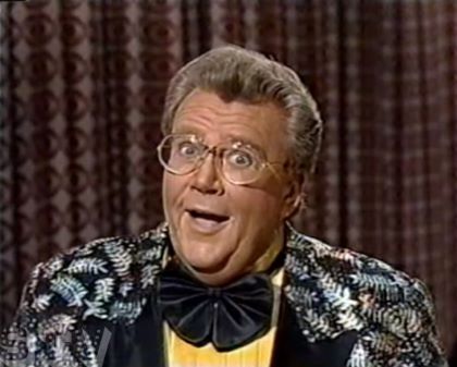 Rod is wearing a Black jacket with silver ferns, a black frilly bow-tie and a yellow silk shirt