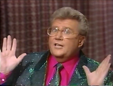 Rod is wearing a dark-green sequined jacket with matching tie &
fuchsia shirt