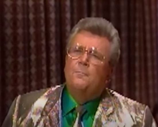 Rod is wearing a Gold Lamé jacket, matching tie & green shirt