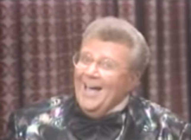 Rod is wearing an iridescent jacket, black bow-tie & white shirt