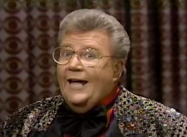 Rod is wearing a Gold/Black Checked Jacket, Black silk Bowtie & Red Silk Shirt