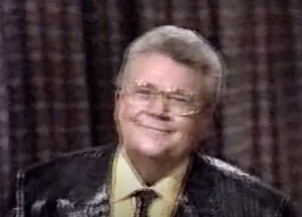 Rod is wearing a black sequined jacket with matching tie & yellow shirt